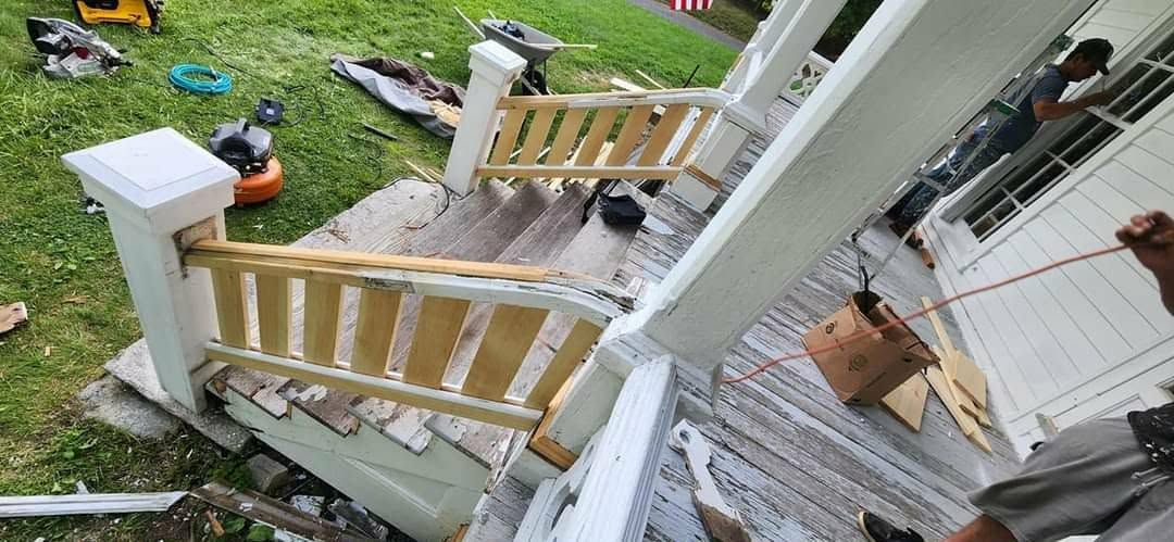 New porch railing sections and posts being built and fitted on site
